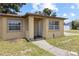 Inviting front entrance with a walkway leading to the front door, and a small covered porch at 525 38Th S St, St Petersburg, FL 33711
