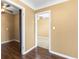 Hallway showcasing the home's layout with doorway openings and wood flooring throughout at 525 38Th S St, St Petersburg, FL 33711