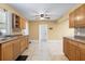 Bright kitchen with ample cabinetry, tile flooring, and a door leading outside at 525 38Th S St, St Petersburg, FL 33711