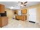 Charming kitchen with wooden cabinets, tile flooring, and essential appliances at 525 38Th S St, St Petersburg, FL 33711