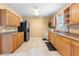 Well-lit kitchen featuring ample cabinet space, tile flooring, and modern appliances at 525 38Th S St, St Petersburg, FL 33711