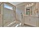 Beautiful bathroom featuring a luxurious glass-enclosed shower and sleek vanity at 5320 Morey Farms Loop, Palmetto, FL 34221