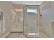 Elegant bathroom featuring a glass shower, modern vanity, and natural light at 5320 Morey Farms Loop, Palmetto, FL 34221