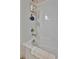 A bathtub with white tile walls, a showerhead, and chrome fixtures at 5320 Morey Farms Loop, Palmetto, FL 34221