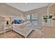 Bright bedroom with ample natural light, comfortable bed, and tasteful decor for a peaceful retreat at 5320 Morey Farms Loop, Palmetto, FL 34221