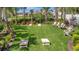 A common green space with a cornhole game and Trex cornhole boards and chairs at 5320 Morey Farms Loop, Palmetto, FL 34221