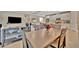 Modern dining room with a view into the open concept living room and kitchen, perfect for entertaining at 5320 Morey Farms Loop, Palmetto, FL 34221