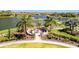 Community fire pit area with seating and lush landscaping, perfect for relaxing and socializing outdoors at 5320 Morey Farms Loop, Palmetto, FL 34221