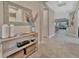 Spacious foyer featuring tile flooring, decor shelving, and a view of the living spaces at 5320 Morey Farms Loop, Palmetto, FL 34221