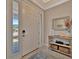 Bright foyer featuring tile flooring, decor shelving, and a view of the front yard at 5320 Morey Farms Loop, Palmetto, FL 34221