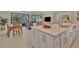 Open-concept kitchen and dining area featuring a large island with seating at 5320 Morey Farms Loop, Palmetto, FL 34221