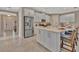Bright kitchen with stainless appliances, expansive island, and breakfast bar seating at 5320 Morey Farms Loop, Palmetto, FL 34221