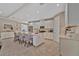 Bright kitchen with white cabinets, stainless steel appliances, and an island with seating at 5320 Morey Farms Loop, Palmetto, FL 34221