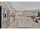 Bright kitchen with stainless appliances, expansive island, and an open layout at 5320 Morey Farms Loop, Palmetto, FL 34221