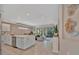 Open-concept kitchen with large island, stainless appliances, and views of the living room at 5320 Morey Farms Loop, Palmetto, FL 34221