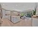 Spacious kitchen with stainless appliances, center island, and an open layout to the living area at 5320 Morey Farms Loop, Palmetto, FL 34221
