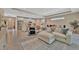 Spacious open-concept living room and kitchen area with modern decor and plenty of natural light from recessed lighting at 5320 Morey Farms Loop, Palmetto, FL 34221