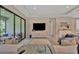 Serene living room with sliding glass doors, comfortable furniture, and media center at 5320 Morey Farms Loop, Palmetto, FL 34221