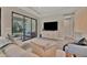 Modern living room with large sliding glass doors and comfortable seating at 5320 Morey Farms Loop, Palmetto, FL 34221
