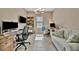 Spacious home office with tile floors, two desks, comfortable chairs, and a sofa at 5320 Morey Farms Loop, Palmetto, FL 34221