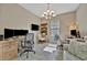 Home office with tile floors, two desks, comfortable chairs, and a sofa at 5320 Morey Farms Loop, Palmetto, FL 34221