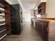 Bright kitchen showcasing wooden countertops, dark cabinets, open shelving, and modern appliances at 5507 Casino Dr, Holiday, FL 34690