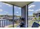 Enjoy the marina views from this condo's private balcony with comfortable chairs and a small table at 5722 Biscayne Ct # 107, New Port Richey, FL 34652