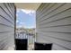 View from balcony overlooking a marina, with two chairs and a rail at 5722 Biscayne Ct # 107, New Port Richey, FL 34652