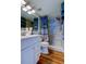 Nautical-themed bathroom featuring a shower with pebble flooring, coastal shower curtain and white vanity at 5722 Biscayne Ct # 107, New Port Richey, FL 34652