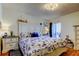 Bedroom featuring a white distressed headboard with matching nightstands, nautical decorations and light walls at 5722 Biscayne Ct # 107, New Port Richey, FL 34652