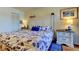 Bedroom featuring a white headboard with matching nightstands, ocean-themed decorations, and light walls at 5722 Biscayne Ct # 107, New Port Richey, FL 34652
