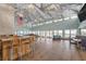 Bright clubhouse featuring a bar, ample seating, and large windows offering serene views at 5722 Biscayne Ct # 107, New Port Richey, FL 34652