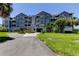 Attractive condo complex with mature landscaping and a covered entry at 5722 Biscayne Ct # 107, New Port Richey, FL 34652