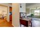 Hallway with furnishings leading to the kitchen and bedroom at 5722 Biscayne Ct # 107, New Port Richey, FL 34652