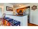 Kitchen featuring stainless steel appliances, granite countertops, bar seating and wood cabinets at 5722 Biscayne Ct # 107, New Port Richey, FL 34652
