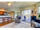 Open floor plan connects living area to the kitchen and screened-in lanai with seating at 5722 Biscayne Ct # 107, New Port Richey, FL 34652
