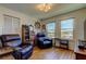 Living room with wood floors, recliners, and a view of the marina at 5722 Biscayne Ct # 107, New Port Richey, FL 34652