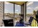 Relaxing screened balcony with seating overlooking a marina and waterfront at 5722 Biscayne Ct # 107, New Port Richey, FL 34652