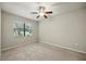 Bedroom showcasing natural light from the window and neutral color scheme at 5962 Lexington Dr, Parrish, FL 34219