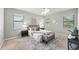 Bedroom with large windows and modern furnishings at 5962 Lexington Dr, Parrish, FL 34219
