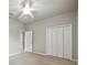 Neutral bedroom featuring carpeted flooring, large closet and a ceiling fan at 5962 Lexington Dr, Parrish, FL 34219