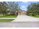 Beautiful two-story home featuring a wide driveway, a three car garage and a well-maintained lawn at 5962 Lexington Dr, Parrish, FL 34219