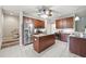 Modern kitchen with stainless steel appliances, a center island, and updated countertops at 5962 Lexington Dr, Parrish, FL 34219