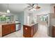 Spacious kitchen with granite countertops, a center island, and an open layout at 5962 Lexington Dr, Parrish, FL 34219