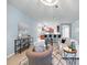 Bright living room boasts an open concept with tile flooring, neutral paint, and stylish furnishings at 5962 Lexington Dr, Parrish, FL 34219