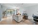 Neutral Living Room features recessed lights, tiled floors, a large picture window and access to bar seating at 5962 Lexington Dr, Parrish, FL 34219