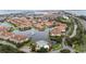 Aerial view of homes, ponds and community pool and clubhouse in waterfront setting at 6 Academy S Way # 221, St Petersburg, FL 33711