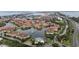 Waterfront neighborhood featuring meticulously maintained landscaping and a tranquil pond with a fountain at 6 Academy S Way # 221, St Petersburg, FL 33711
