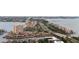 An aerial view showcasing the coastal property's proximity to the beach, waterway and nearby city at 6 Academy S Way # 221, St Petersburg, FL 33711