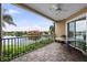 Relaxing balcony area, with views of the lake and community, and adorned with elegant patio furniture at 6 Academy S Way # 221, St Petersburg, FL 33711
